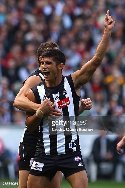 Sharrod Wellingham of the Magpies celebrates kicking a goal during the round five AFL match between the Collingwood Magpies and the Essendon Bombers...