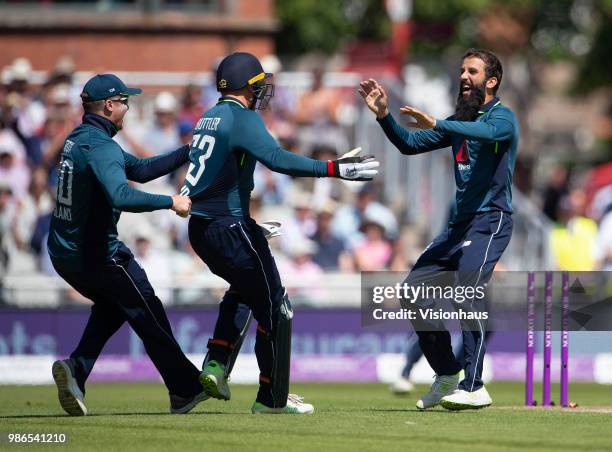 Moeen Ali of England celebrates with Jason Roy and Jos Buttler after taking the wicket of Tim Paine of Australia during the 5th Royal London ODI...