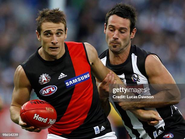 Jobe Watson of the Bombers is tackled be Alan Didak of ther Magpies during the round five AFL match between the Collingwood Magpies and the Essendon...