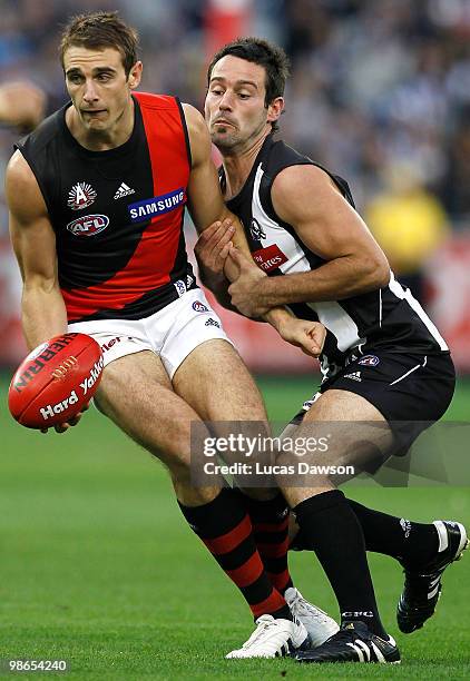 Jobe Watson of the Bombers is tackled be Alan Didak of ther Magpies during the round five AFL match between the Collingwood Magpies and the Essendon...