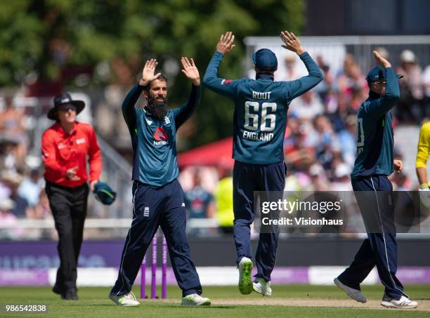 Moeen Ali of England celebrates with Joe Root after taking the wicket of Shaun Marsh of Australia during the 5th Royal London ODI between England and...