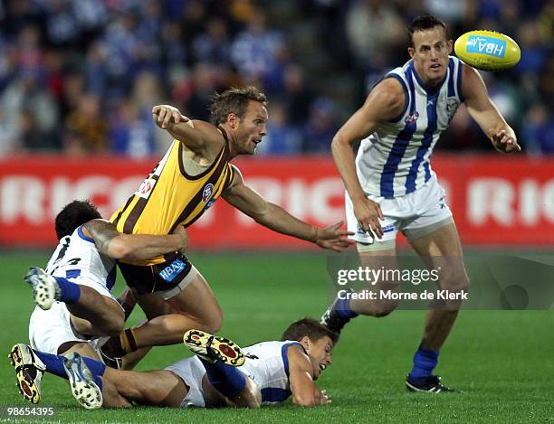 Brad Sewell of the Hawks is surrounded by Kangaroo players during the round five AFL match between the Hawthorn Hawks and the North Melbourne...