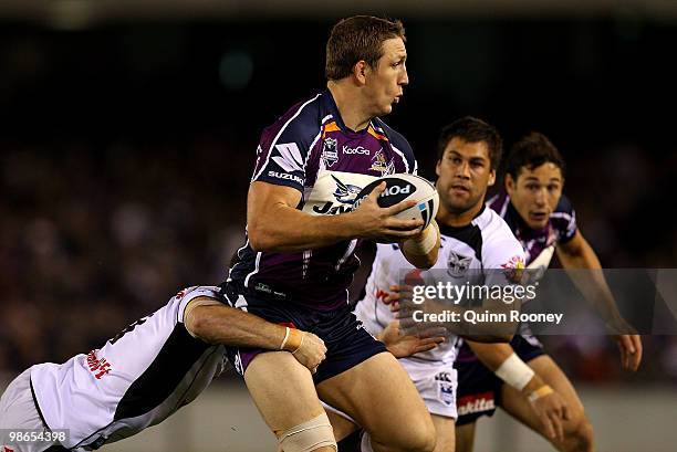 Ryan Hoffman of the Storm is tackled during the round seven NRL match between the Melbourne Storm and the Warriors at Etihad Stadium on April 25,...