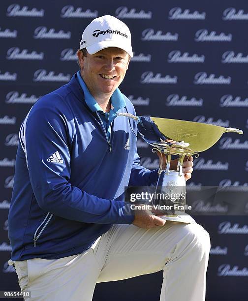 Marcus Fraser of Australia poses with the trophy after winning the Ballantine's Championship at Pinx Golf Club on April 25, 2010 in Jeju, South Korea.