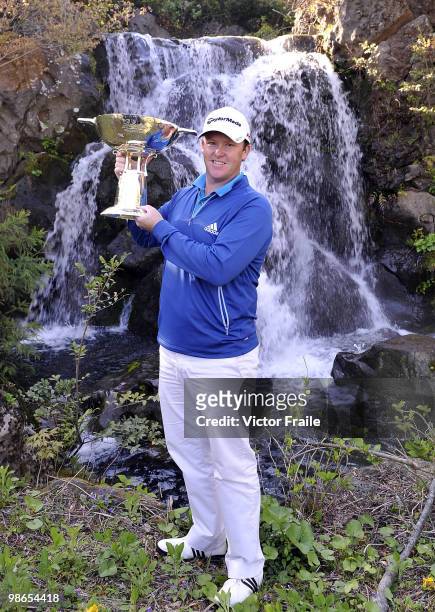 Marcus Fraser of Australia poses with the trophy after winning the Ballantine's Championship at Pinx Golf Club on April 25, 2010 in Jeju, South Korea.