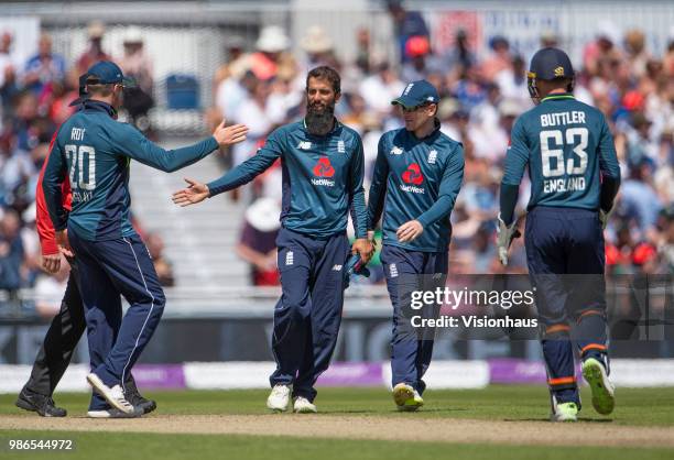 Moeen Ali of England is congratulated by Jason Roy after taking the wicket of Billy Stanlake of Australia during the 5th Royal London ODI between...