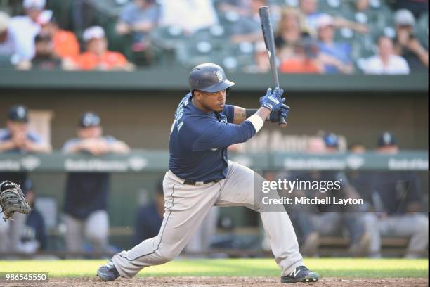 Jean Segura of the Seattle Mariners singles in the tenth inning to score Dee Gordon during a baseball game against the Baltimore Orioles at Oriole...