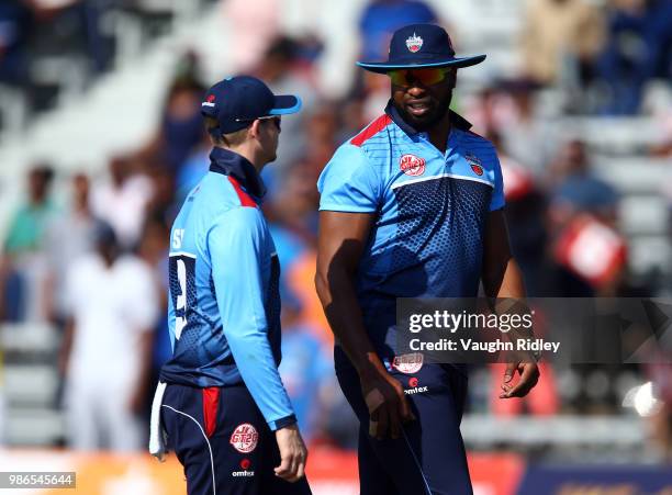 Steven Smith of Toronto Nationals talks with teammate Kieron Pollard during a Global T20 Canada match against Vancouver Knights at Maple Leaf Cricket...