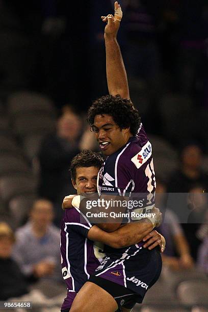 Matt Duffie and Adam Blair of the Storm celebrate scoring a try during the round seven NRL match between the Melbourne Storm and the Warriors at...