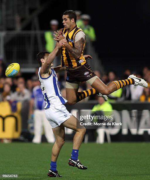 Lance Franklin of the Hawks drops a mark but gets a free kick against Scott Thompson of the Kangaroos during the round five AFL match between the...