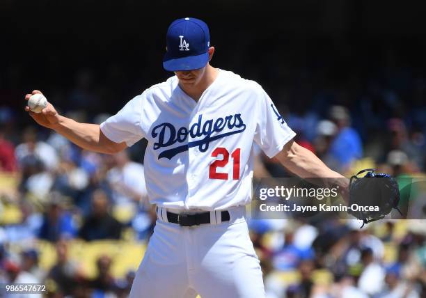 Walker Buehler of the Los Angeles Dodgers shows his frustration as he is pulled from the game after allowing the Chicago Cubs five runs in the sixth...