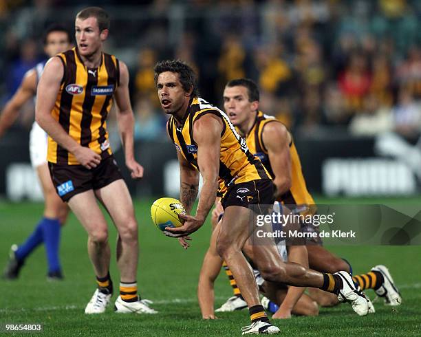 Chance Bateman of the Hawks passes the ball during the round five AFL match between the Hawthorn Hawks and the North Melbourne Kangaroos at Aurora...