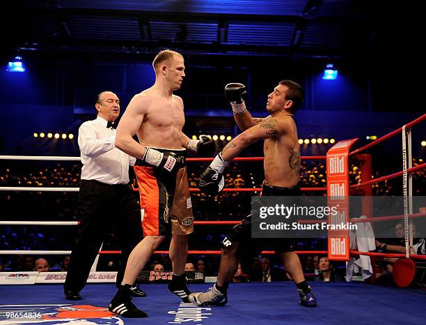 Juergen Braehmer of Germany knocks down Mariano Nicolas Plotinsky of Argentina during their WBO light heavyweight fight during the Universum...