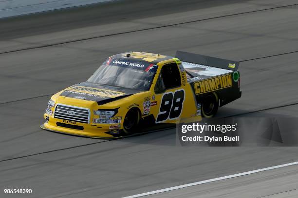 Grant Enfinger, driver of the Champion Power Equipment/Curb Records Ford, practices for the NASCAR Camping World Truck Series Overton's 225 at...