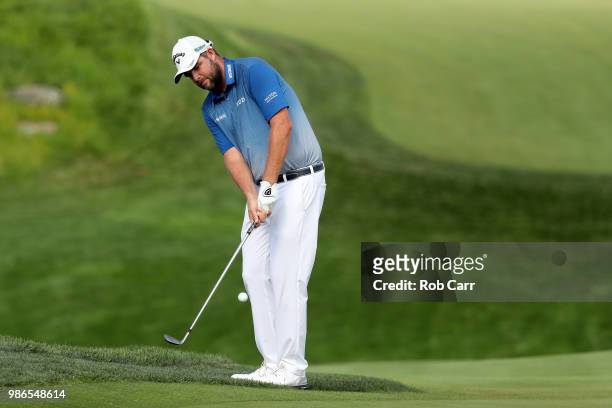 Marc Leishman of Australia plays a shot onto the 16th green during the first round of the Quicken Loans National at TPC Potomac on June 28, 2018 in...