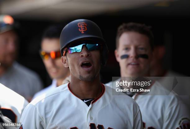 Gorkys Hernandez of the San Francisco Giants reacts in the dugut after he scored in the eighth inning against the Colorado Rockies at AT&T Park on...