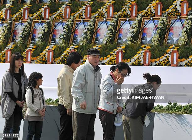 South Korean citizens visit an altar at city hall in Seoul on April 25, 2010 set up to pay tribute to sailors who were killed in the March 26 sinking...