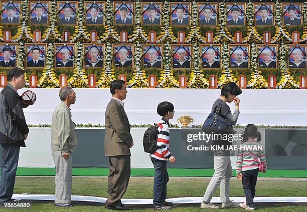 South Koreans visit an altar at city hall in Seoul on April 25, 2010 set up to pay tribute to sailors who were killed in the March 26 sinking of the...