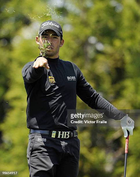 Pablo Larrazabal of Spain checks the wind direction on the 14th hole during the Round Three of the Ballantine's Championship at Pinx Golf Club on...