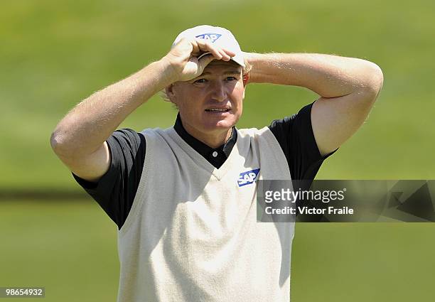 Ernie Els of South Africa adjusts his cap on the 11th green during the Round Three of the Ballantine's Championship at Pinx Golf Club on April 25,...