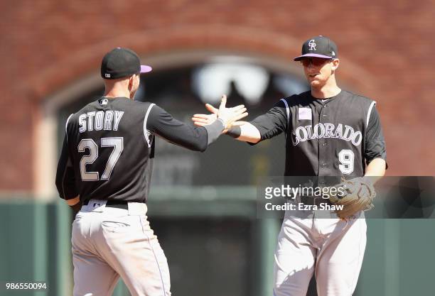 LeMahieu and Trevor Story of the Colorado Rockies shake hands after they beat the San Francisco Giants at AT&T Park on June 28, 2018 in San...