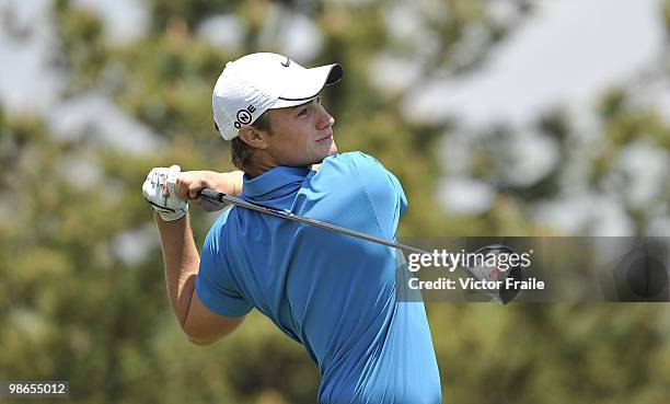 Oliver Fisher of England tees off on the 14th hole during the Round Three of the Ballantine's Championship at Pinx Golf Club on April 25, 2010 in...