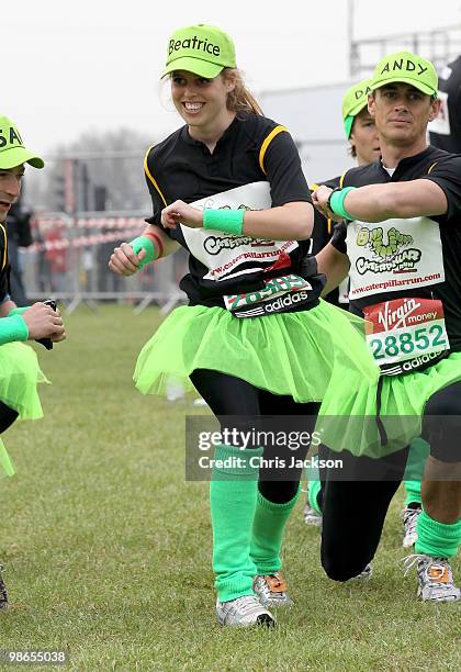 Princess Beatrice warms up as she prepares to take part in the Virgin London Marathon on April 25, 2010 in London, England. The Princess is competing...