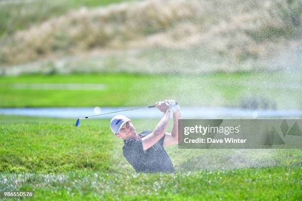 Laurie CANTER of England hits out of a bunker during the HNA French Open on June 28, 2018 in Saint-Quentin-en-Yvelines, France.