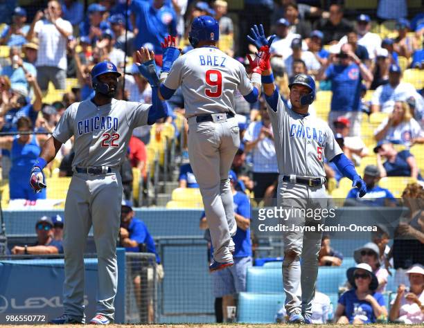 Jason Heyward, Albert Almora Jr. #5 and Javier Baez scored on a double by Anthony Rizzo of the Chicago Cubs in the seventh inning of the game against...