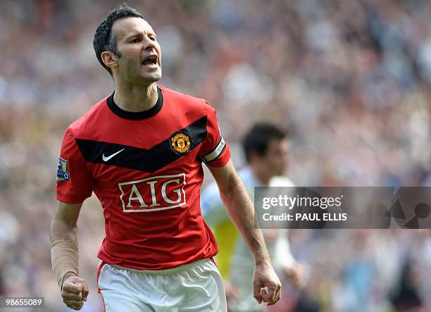 Manchester United's Welsh midfielder Ryan Giggs celebrates scoring a penalty against Tottenham Hotspur during their English Premier League football...