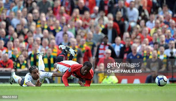 Tottenham Hotspur's Cameroonian defender Benoit Assou-Ekotto fouls Manchester United's French defender Patrice Evra for a penalty during their...