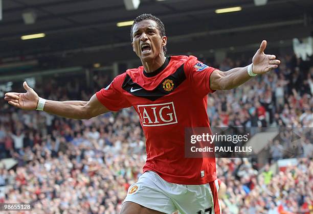 Manchester United's Portuguese midfielder Nani celebrates after scoring against Tottenham Hotspur during their English Premier League football match...