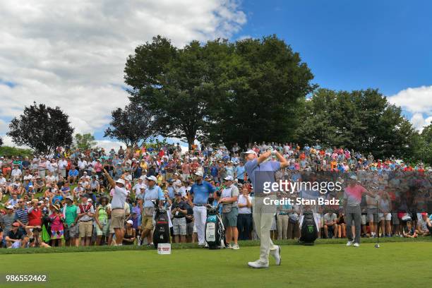 Bill Haas hits a tee shot on the first hole during the first round of the Quicken Loans National at TPC Potomac at Avenel Farm on June 28, 2018 in...