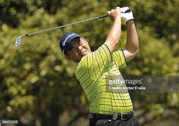 Chan Yih-shin of Taiwan tees off on the 14th hole during the Round Three of the Ballantine's Championship at Pinx Golf Club on April 25, 2010 in...