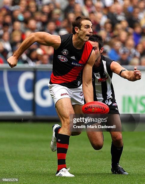 Jobe Watson of the Bombers looks to handball during the round five AFL match between the Collingwood Magpies and the Essendon Bombers at Melbourne...