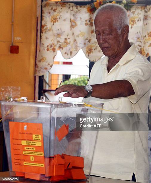 Man cases his vote at a polling centre for the Hulu Selangor parliamentary by-election in Hulu Selangor on April 25, 2010. Voters went to the polls...