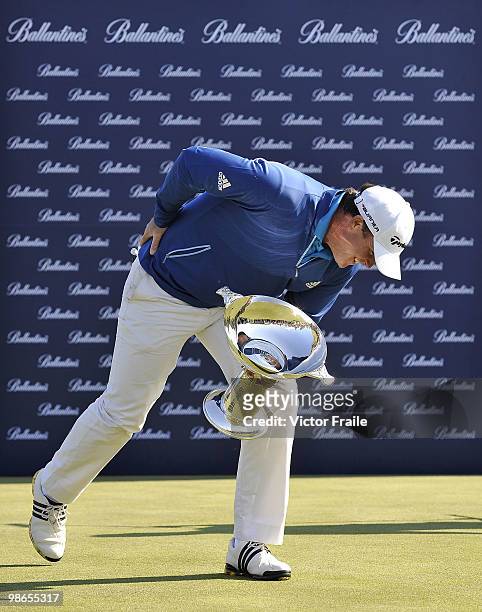 Marcus Fraser of Australia gestures with the trophy for the media the Ballantine's Championship at Pinx Golf Club on April 25, 2010 in Jeju, South...