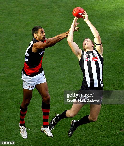 Nathan Lovett-Murray of the Bombers is outmarked by Heath Shaw of the Magpies during the round five AFL match between the Collingwood Magpies and the...