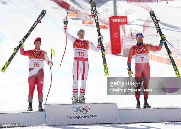 Beat Feuz of Switzerland, Matthias Mayer of Austria and Kjetil Jansrud of Norway at the award ceremony after the men's Super G alpine skiing event...