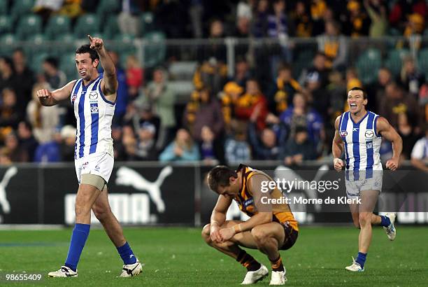 Kangaroos players celebrate winning the game during the round five AFL match between the Hawthorn Hawks and the North Melbourne Kangaroos at Aurora...