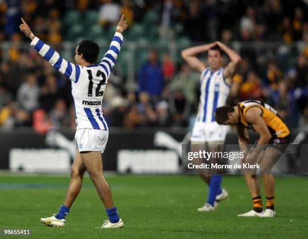 Kangaroos players celebrate winning the game during the round five AFL match between the Hawthorn Hawks and the North Melbourne Kangaroos at Aurora...