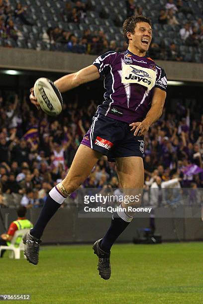 Matt Duffie of the Storm celebrates scoring a try during the round seven NRL match between the Melbourne Storm and the Warriors at Etihad Stadium on...