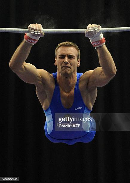 Romania's Ovidiu Buidoso performs on the horizontal bar during the mens senior final, in the European Artistic Gymnastics Team Championships 2010, at...