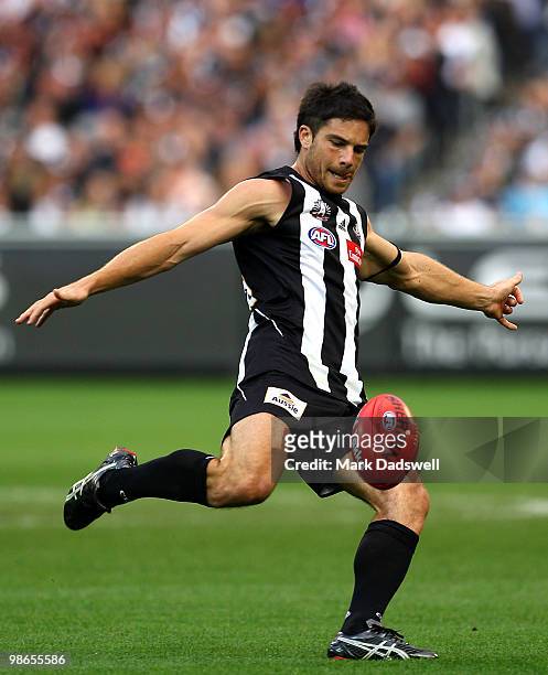 Paul Medhurst of the Magpies looks to pass to a teammate during the round five AFL match between the Collingwood Magpies and the Essendon Bombers at...