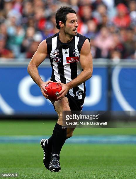 Alan Didak of the Magpies looks to pass to a teammate during the round five AFL match between the Collingwood Magpies and the Essendon Bombers at...