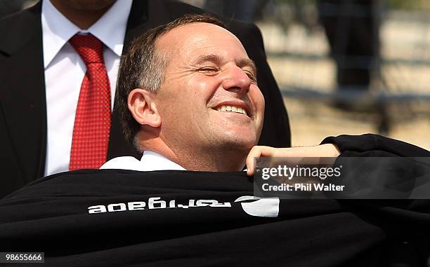 New Zealand Prime Minister John Key pulls on a hooded sweatshirt prior to the New Zealand Commemorative Service at Chunuk Bair on April 25, 2010 in...
