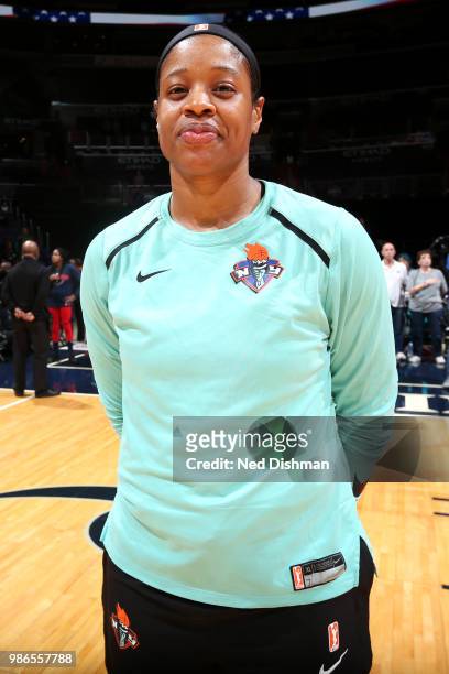 Kia Vaughn of the New York Liberty stands during the national anthem before the game against the Washington Mystics on June 28, 2018 at Capital One...