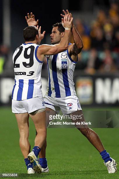 Daniel Wells and Brent Harvey of the Kangaroos celebrates a goal during the round five AFL match between the Hawthorn Hawks and the North Melbourne...