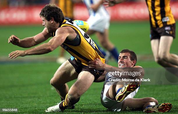 Campbell Brown of the Hawks is tackled by Ben Cunnington of the Kangaroos during the round five AFL match between the Hawthorn Hawks and the North...