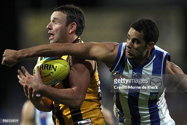 Brent Guerra of the Hawks and Daniel Wells of the Kangaroos compete for the ball during the round five AFL match between the Hawthorn Hawks and the...